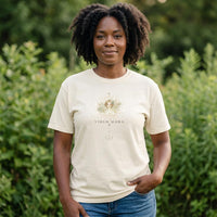 Woman wearing Virgo Mama ivory zodiac graphic t-shirt outdoors with greenery background