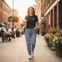 Smiling woman walking down a city street holding a coffee cup, surrounded by urban elements.