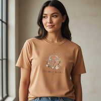 Load image into Gallery viewer, Close-up of woman wearing Taurus Mama sandstone celestial graphic tee showing artwork detail