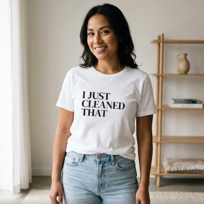 Woman wearing white “I Just Cleaned That” t-shirt indoors, relaxed fit casual mom outfit