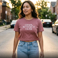 Woman wearing mauve “Chaos, But Make It Cute” graphic tee walking outdoors, casual everyday outfit
