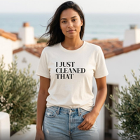 Woman wearing white “I Just Cleaned That” graphic t-shirt outdoors, everyday mom outfit with jeans