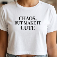 Close-up of white “Chaos, But Make It Cute” graphic t-shirt with bold black typography