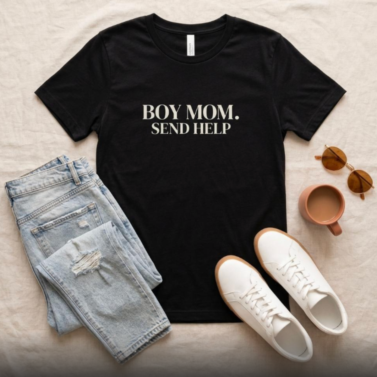 Black “Boy Mom. Send Help” graphic t-shirt flat lay with jeans and sneakers, casual mom outfit styling