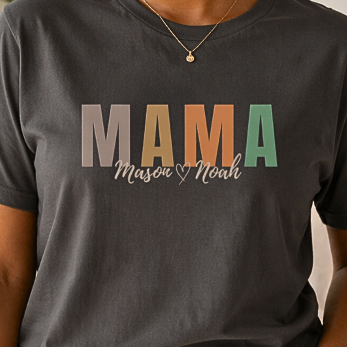 Close up custom mama shirt with kids names in script font, personalized earth tone mama design on pepper tee