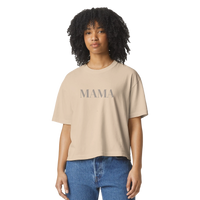 Model wearing ivory MAMA cropped tee styled casually with denim