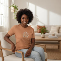 Load image into Gallery viewer, Woman wearing Taurus Mama sandstone zodiac graphic t-shirt indoors in warm neutral living space