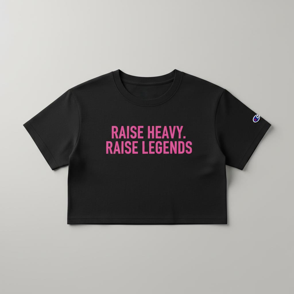 Black women’s cropped Champion tee with pink Raise Heavy Raise Legends graphic flat lay