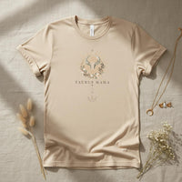 Flat lay of Taurus Mama ivory zodiac graphic t-shirt styled with neutral accessories on linen background