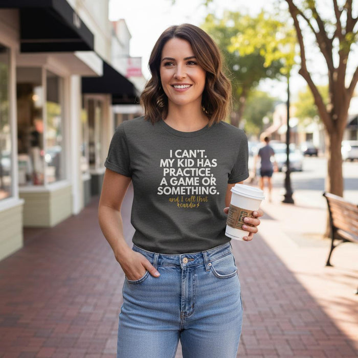Woman wearing a t-shirt with a humorous message on a city street.