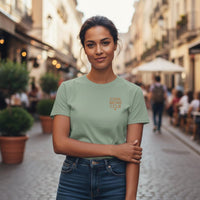 Woman wearing a green t-shirt with 'Cool Moms Club' text on a street.
