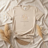 Ivory Pisces Mama zodiac graphic t-shirt flat lay with neutral boho styling and celestial design
