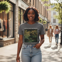 Woman wearing a t-shirt with a graphic design on a city street