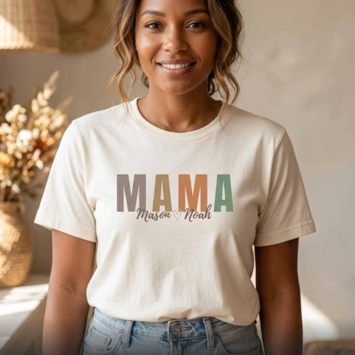 Personalized mama t-shirt with kids names on ivory shirt, woman of color wearing neutral mom tee front tuck