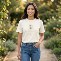 Asian woman wearing Capricorn Mama ivory zodiac graphic t-shirt standing on garden path with one hand in pocket