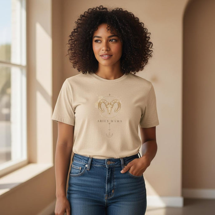 Woman modeling ivory Aries Mama zodiac t-shirt with watercolor ram chest design indoors