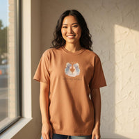 Load image into Gallery viewer, Asian woman wearing sandstone Gemini Mama zodiac t-shirt with watercolor twin design in warm natural light