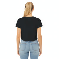 Woman wearing a black t-shirt and light blue jeans on a white background